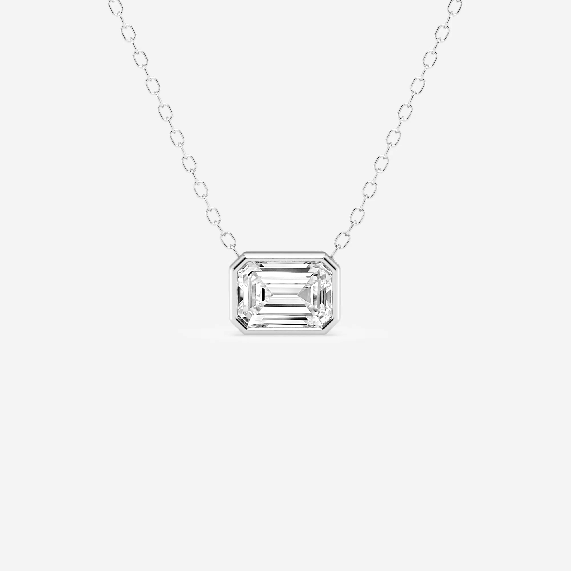 3/4 ct.tw. Emerald Diamond East West Bezel Set Solitaire Pendant with Adjustable Chain in 14K Gold